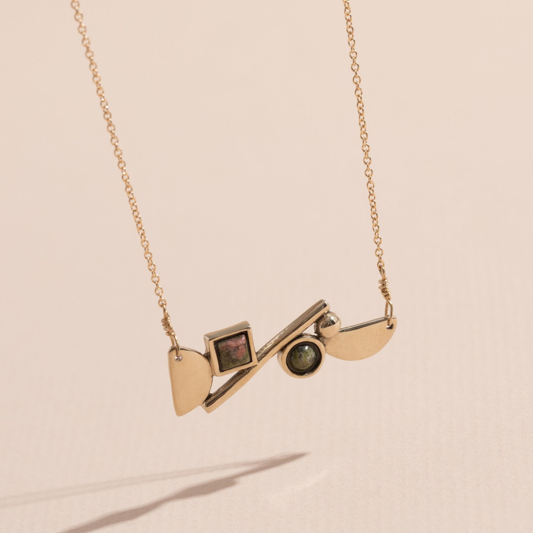 shapes necklace, unakite stones, brass pendant. 